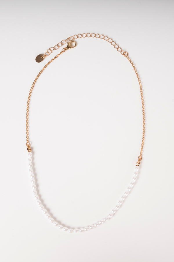 Photo of a necklace top view on white background